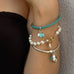 Cropped image of a girls arm. she is wearing Leoni & Vonk bracelets