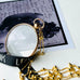 Leoni & Vonk victorian rolled gold photo locket on a vintage postcard and Leoni & Vonk ribbon