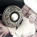 Leoni & Vonk vintage silver celtic brooch on a vintage image.
