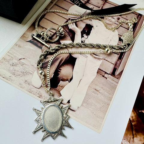 Leoni & Vonk stokes fob watch necklace on a vintage image of mother and child.