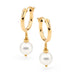 Leoni & Vonk gold hoop and white pearl earrings photographed against a white background