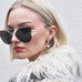 Model wearing Leoni & Vonk bianca pearl and gold hoop earring and a fluffy white ZARA jacket