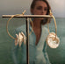 Leoni & Vonk gold fill hoop and keshi pearl earrings photographed on a magazine page