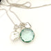 Leoni & Vonk March birthstone aquamarine pearl and heart necklace on a white background