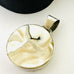 Leoni & Vonk mother of pearl pendant on a white background