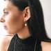 Model wearing Leoni & Vonk Bianca hoop pearl earring