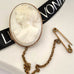 Leoni & Vonk antique white shell cared brooch with 9ct gold frame with Leoni & Vonk ribbon
