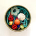 Leoni & Vonk colourful bead tin containing beads of different shapes and sizes
