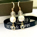 Leoni & Vonk keshi pearl and crystal drop earrings on a box with Leoni & Vonk ribbon