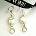 Leoni & Vonk keshi pearl and crystal earrings on a white background