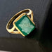 Leoni & Vonk 18ct gold green cameo ring on a white background and with black ribbon