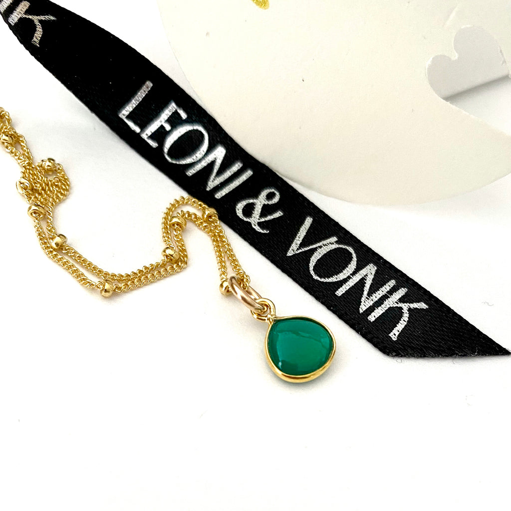 Leoni  Vonk green onyx gold drop necklace photographed with Leoni & vonk ribbon