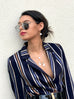 Model wearing Leoni & Vonk jewellery and an H&M striped jacket