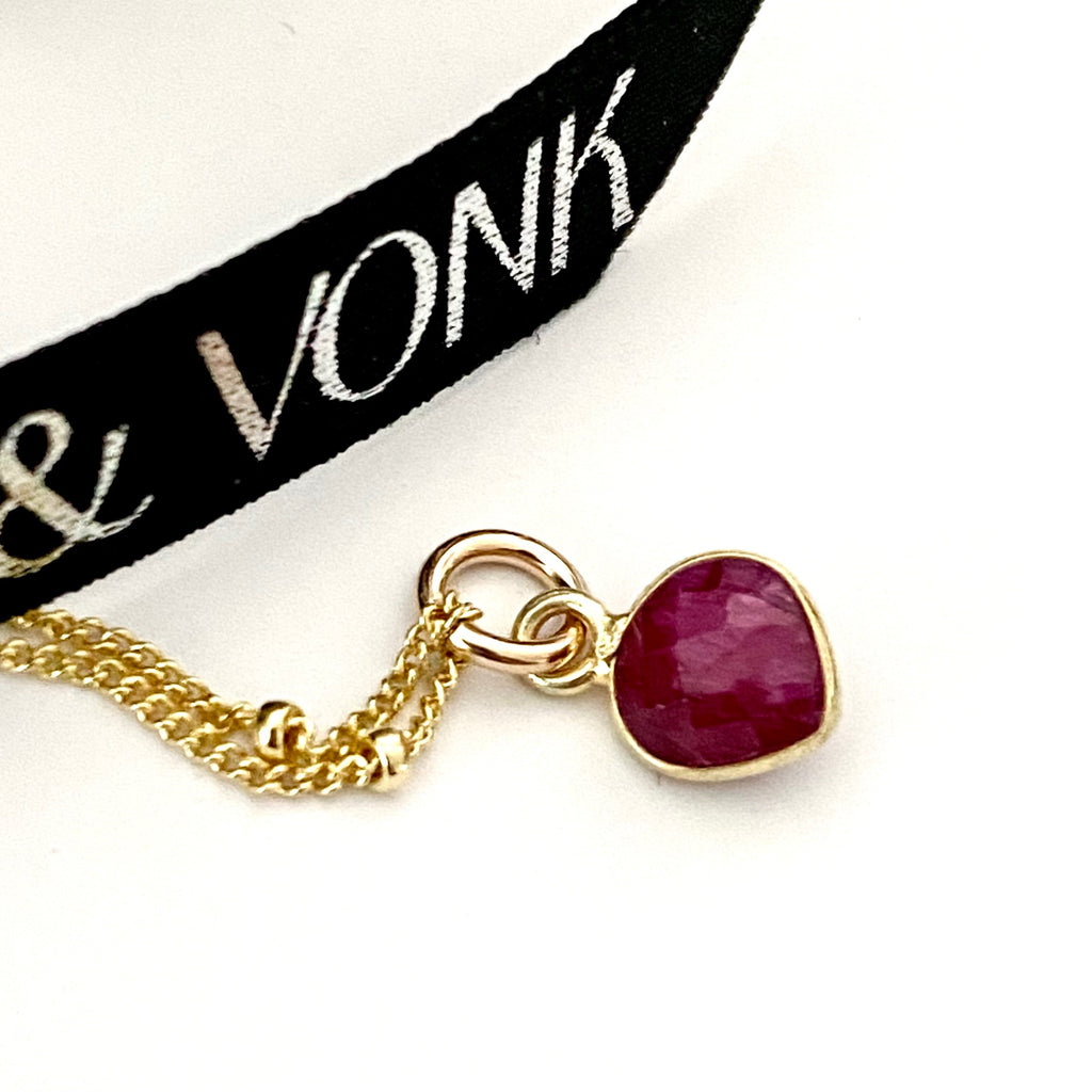 Leoni & Vonk july birthstone ruby heart necklace photogprahed near Leoni & Vonk ribbon