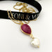 Leoni & Vonk ruby and keshi pearl gold necklace photographed near leoni & Vonk ribbon. Ruby is one of July's birthstones