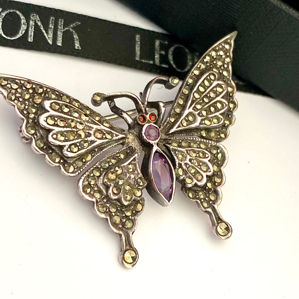 Leoni & Vonk vintage sterling silver marcasite butterfly brooch on a white background and with Leoni & Vonk ribbon