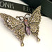 Leoni & Vonk vintage sterling silver marcasite butterfly brooch on a white background and with Leoni & Vonk ribbon