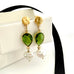 Leoni & Vonk August birthstone peridot and pearl earrings with a gold stud on a white box and with black ribbon