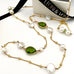 Leoni & Vonk peridot and keshi pearl August birthstone gold necklace photogrpahed with Leoni & Vonk ribbon and a white box
