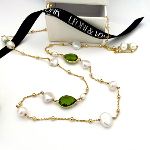 Leoni & Vonk peridot and keshi pearl August birthstone gold necklace photogrpahed with Leoni & Vonk ribbon and a white box