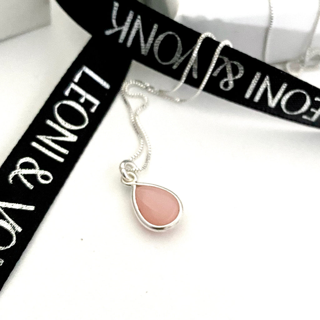 Leoni & Vonk pink opal sterling silver necklace photographed near Leoni & Vonk ribbon