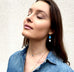Model wearing Leoni & Vonk December's birthstone turquoise jewellery and a denim shirt