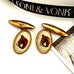 Leoni & Vonk vintage gilt and lucite cufflinks featuring a red/brown horses head and with the corner of an image of tattooed woman