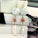 Leoni & Vonk white 1940's Venetian beads with crystals and long white keshi pearls on a white box and with Leoni & Vonk ribbon