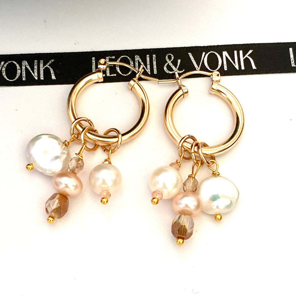 Leoni & Vonk gold hoop earrings with pearl and crystal drops on a white background and with Leoni & Vonk ribbon