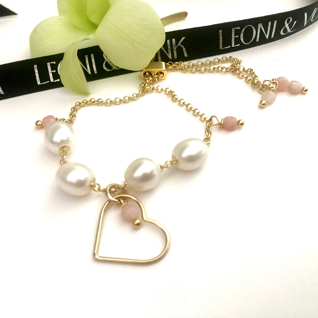 Leoni & Vonk gold, pearl, pink opal bracelet with a yellow flower and Leoni & Vonk black ribbon